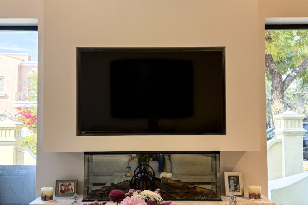 Sleek Media Center Design | Minimalist Plastered Wall & Natural Marble Accent