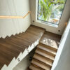 Bespoke Stairway Solution | Integrated Oak Wall Cladding & Illuminated Floating Treads