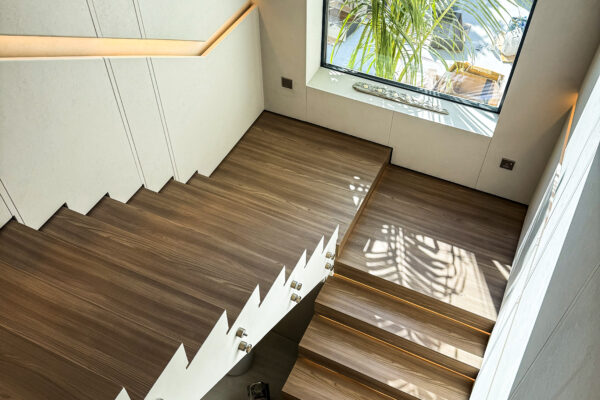 Bespoke Stairway Solution | Integrated Oak Wall Cladding & Illuminated Floating Treads