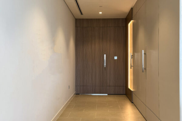 Architectural Corridor Design | Full-Height Oak Doors & Integrated Wall Lighting