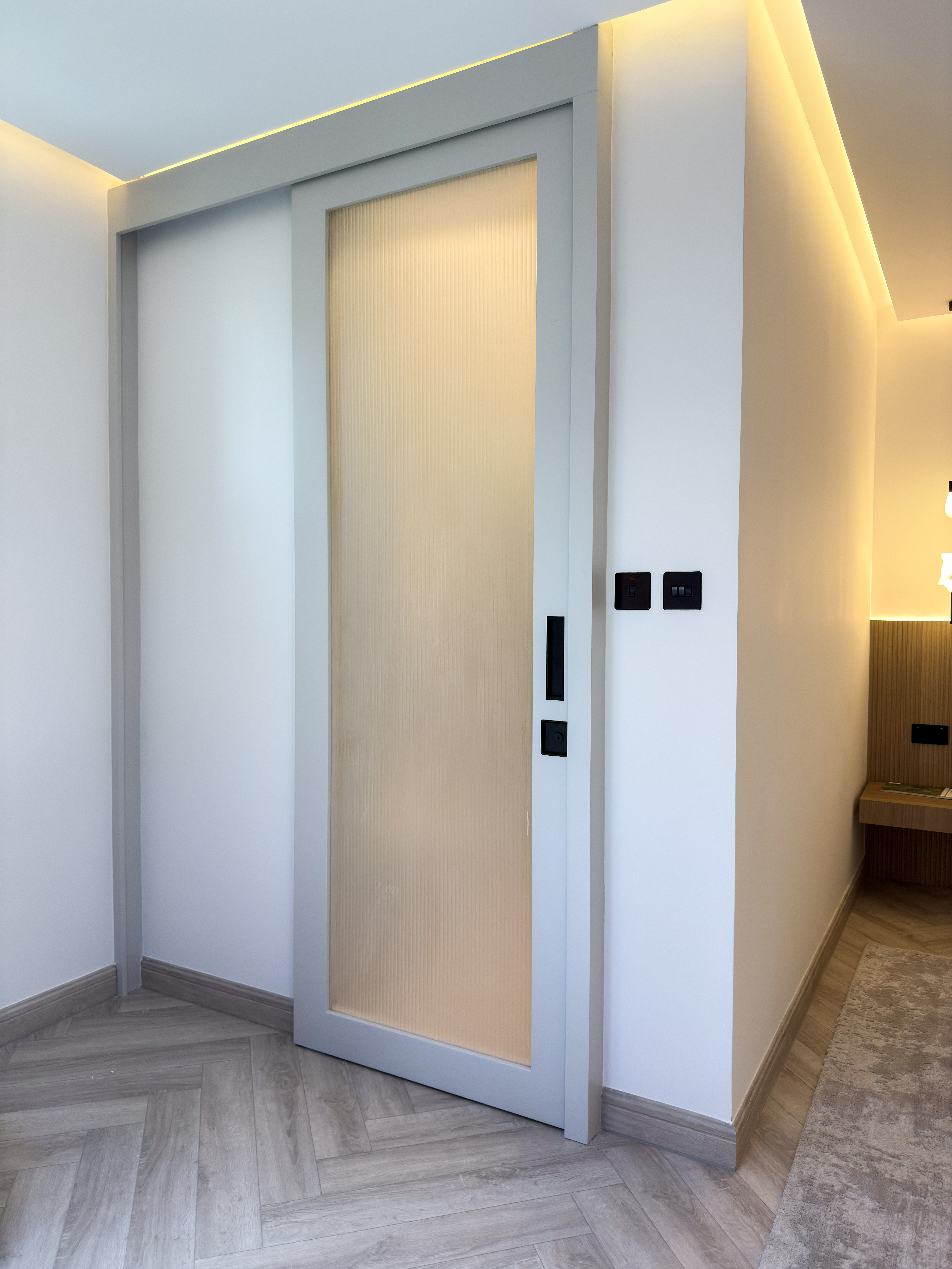 Alternative view of Classic Contemporary Interior Door | Fluted Wood Slat Wall & Accent Lighting