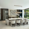 Modern Open-Plan Dining | Travertine Textures & Custom Glass Cabinetry