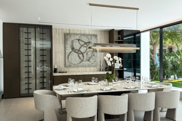 Modern Open-Plan Dining | Travertine Textures & Custom Glass Cabinetry