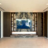 Luxury TV Feature Wall | Bookmatched Marble Accent & Hidden Storage Joinery