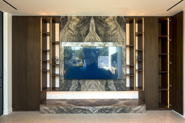Luxury TV Feature Wall | Bookmatched Marble Accent & Hidden Storage Joinery