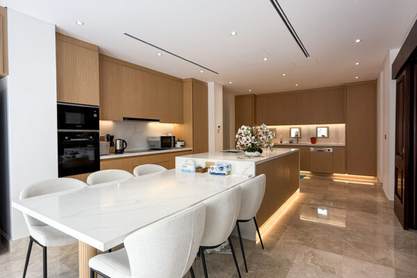 Alternative view of Integrated Kitchen Island & Dining Table | Elegant Oak Cabinets & Marble Floors