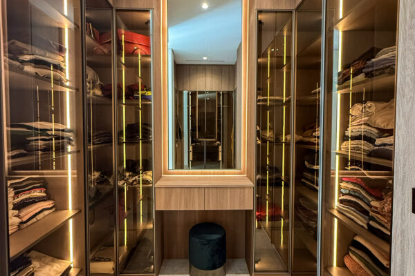 Luxury Walk-In Closet Layout | Tinted Glass Wardrobes & Integrated LED Lighting