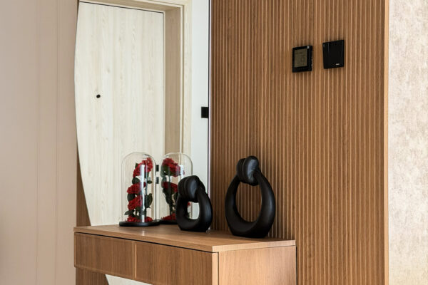 Alternative view of Modern Luxury Foyer & Coffee Station | Curved Wood Joinery & Arch Mirror