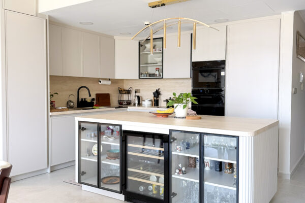 Modern Bright Kitchen Architecture | Glass-Front Island & Pocket Door Pantry